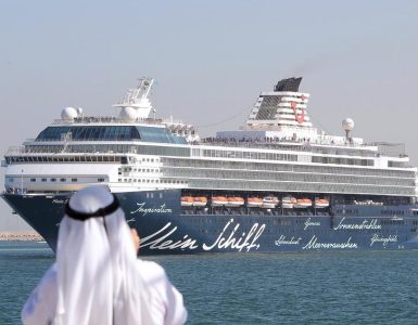 Image Represents An Arabic Businessman Starring A Large Cruise Ship From Shipyard