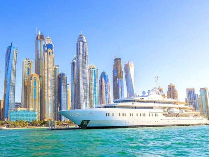 Large Cruise Ship Crossing THe City Dubai On A Sunny Day